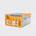 OnLogic Helix 524 Industrial PC Side view of the orange and silver OnLogic Helix 524 industrial computer featuring a prominent heat sink for fanless operation and multiple input/output connectors.