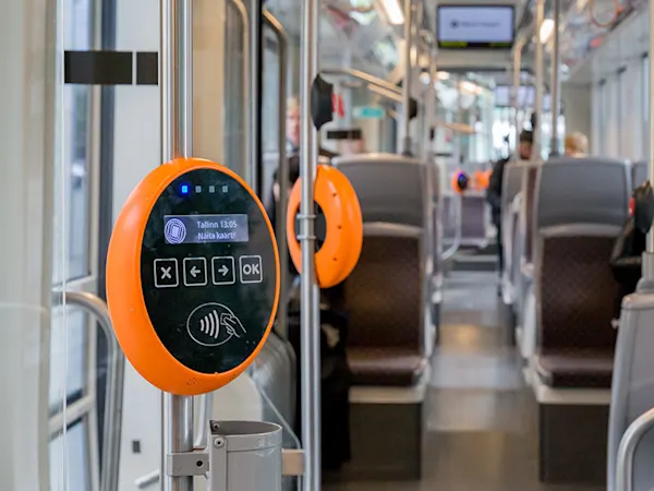 A smart card reader is mounted inside a modern bus used as digital ...