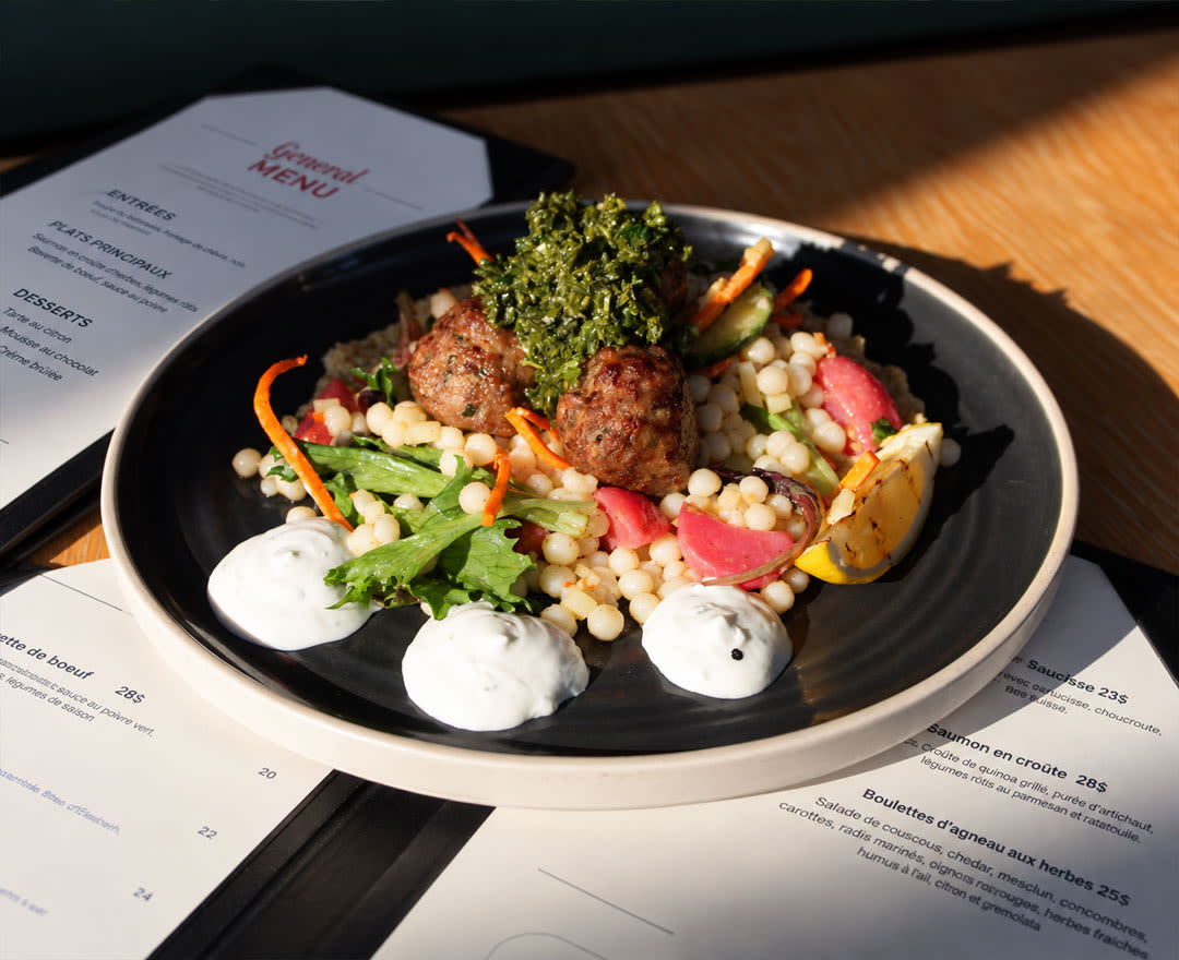 A colorful dish featuring fresh vegetables and a generous topping is beautifully presented in an inviting culinary setting.