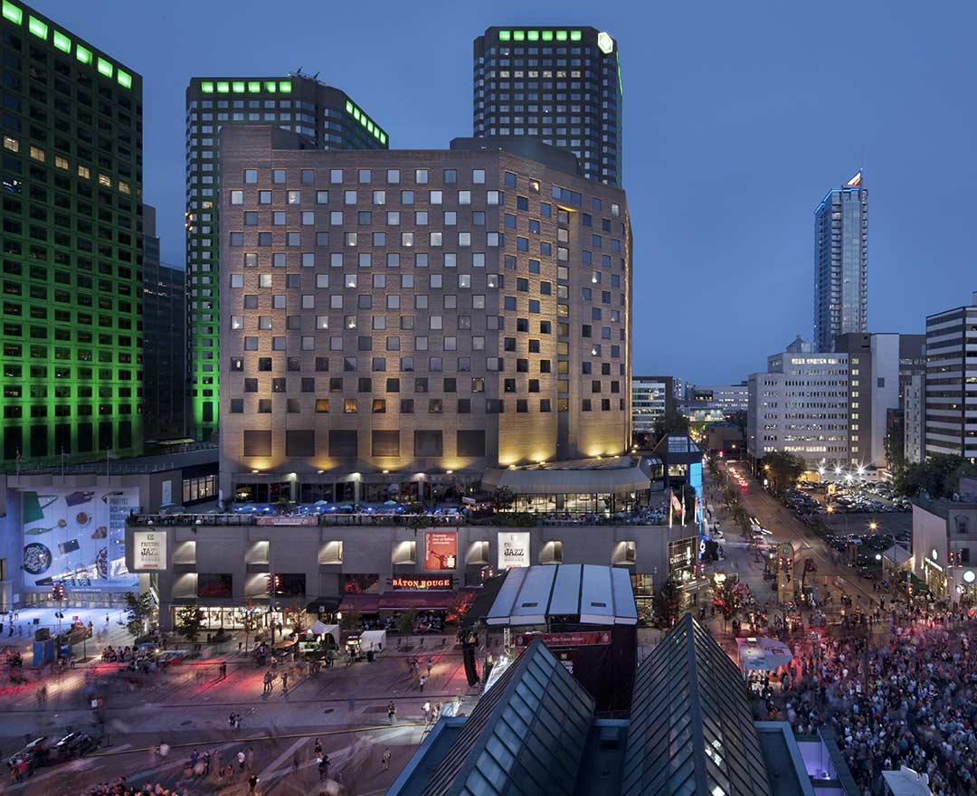 palais des congrès de montréal exterior has colored glass panels covering its exterior