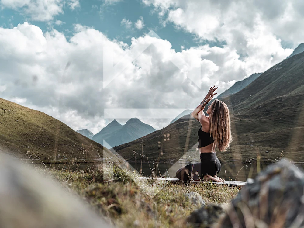 A woman doing yoga outdoors