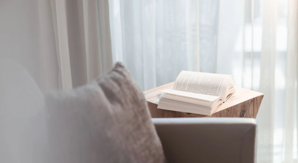 Sofa and book - Valsana Hotel Arosa