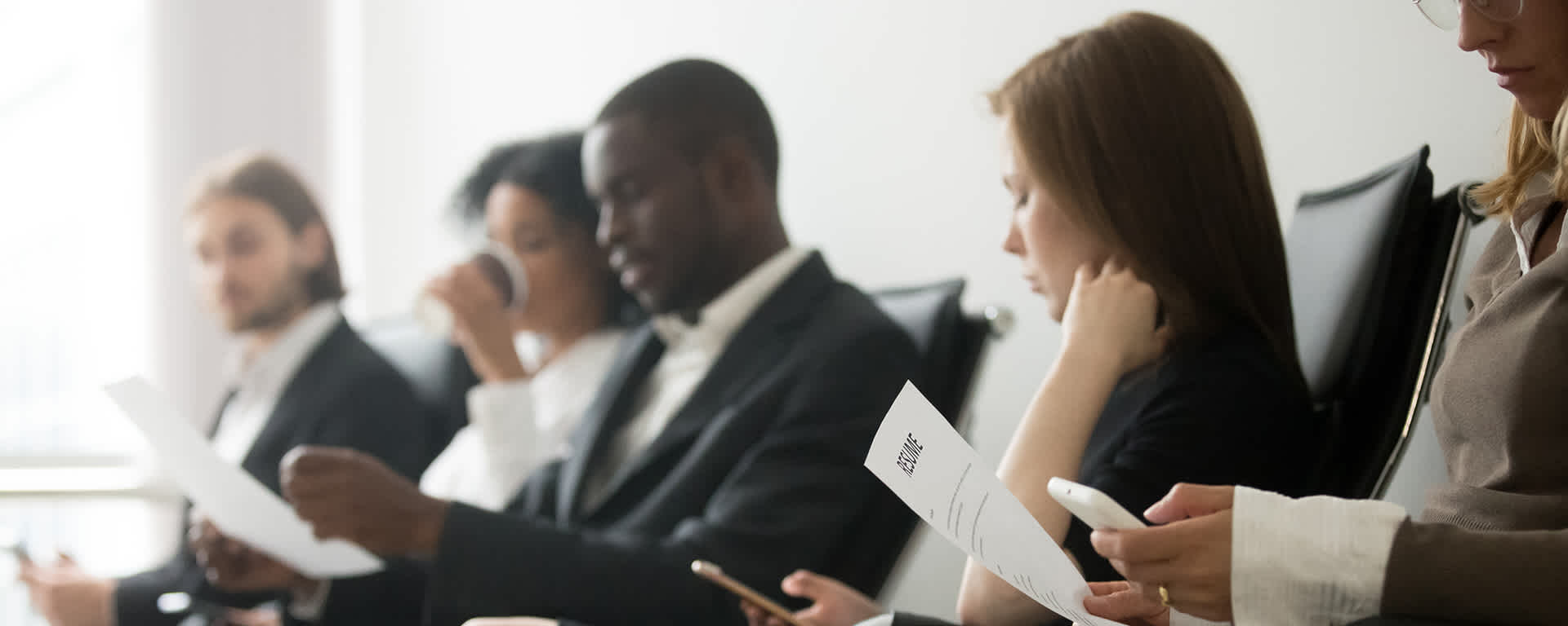 A diverse group of applicants prepare for their IT job interview | Blog