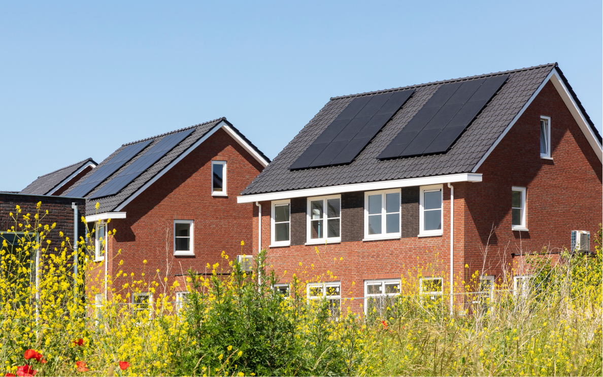 home with solar panels and flowers 