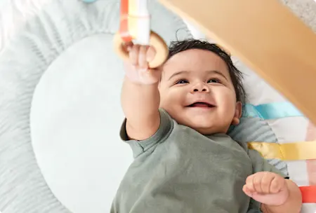 Baby Reaching for Toy