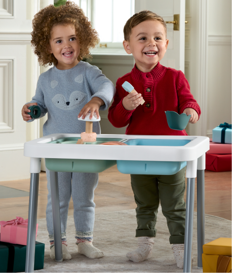 2 kids playing with Sensory Table