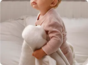 A boy & his mom making orange juice