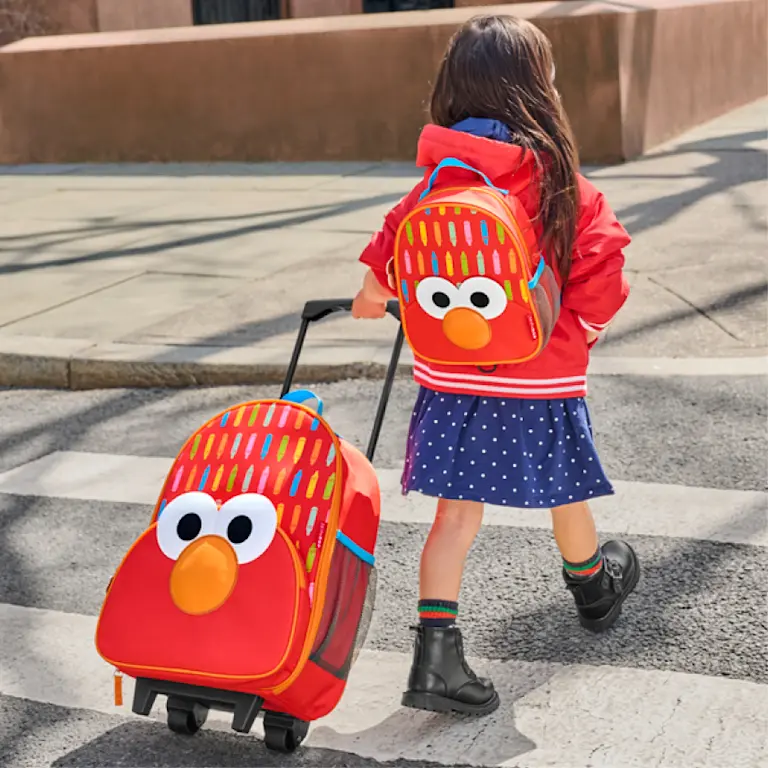 kid pulling luggage