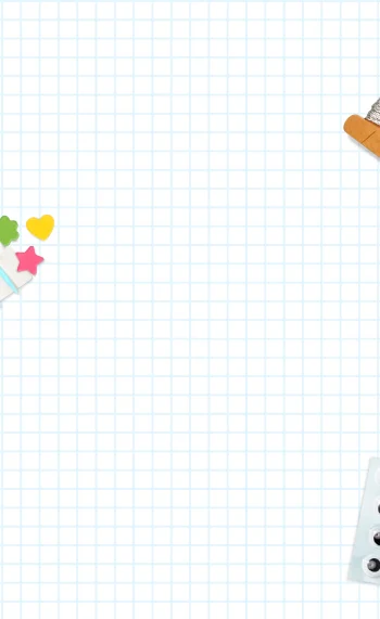 A sheet of graph paper with crafts strewn about
