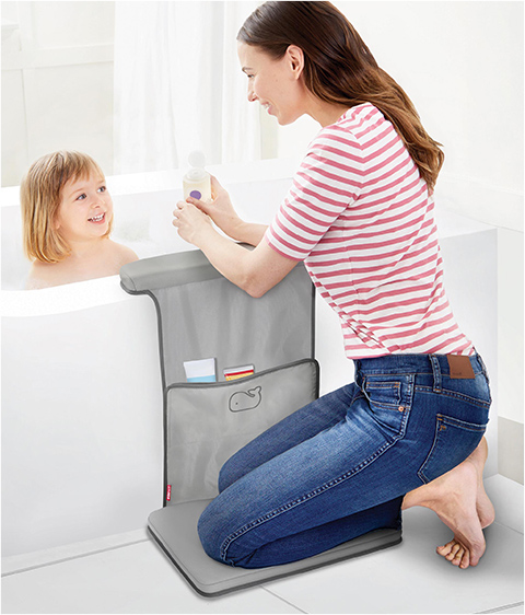 mom kneeling at tub