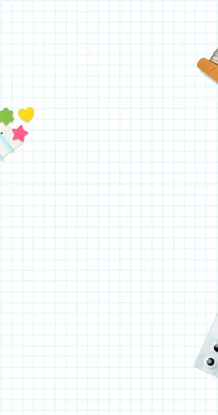 A sheet of graph paper with crafts strewn about