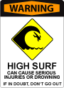 A sign with bold, red lettering at the top that says "Warning". Iconography depicts large waves near shore and has text underneath it that says: "High surf can cause serious injuries or drowning. When in doubt, don't go out."
