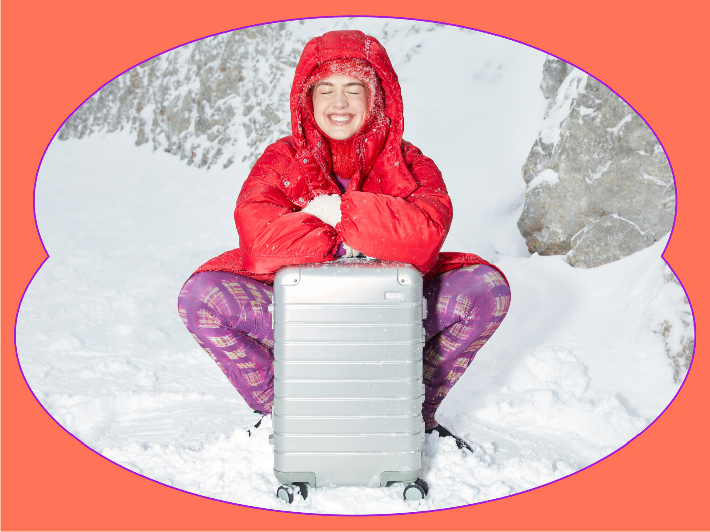 Winter girl holding aluminum luggage