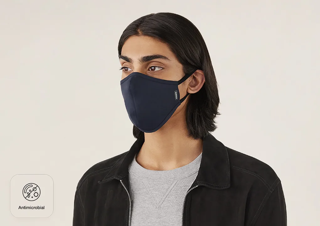 A man wearing an Away reusable cloth face mask.