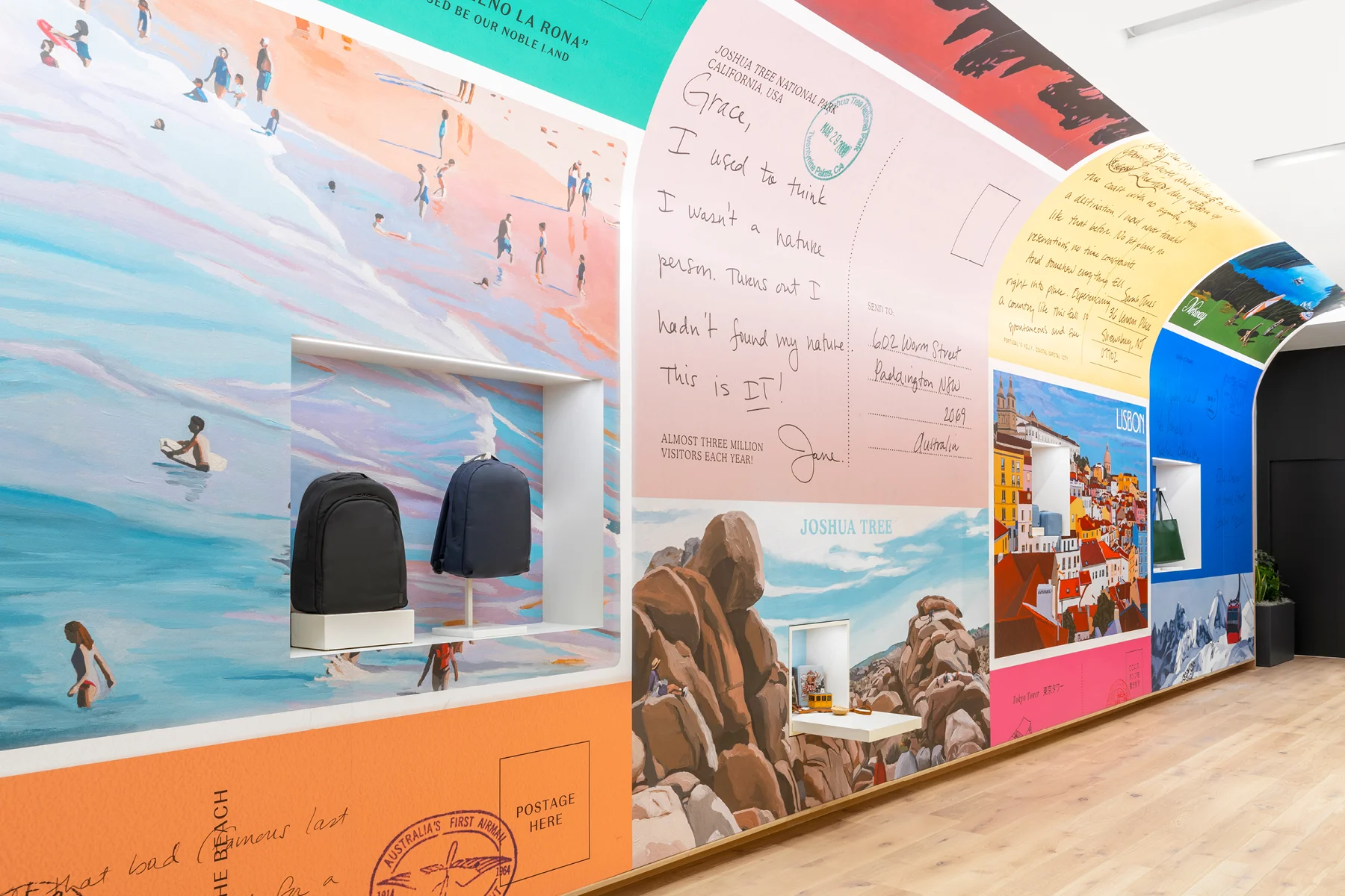 A postcard mural display of customer travels shown through images on the wall in the Away Seattle, Wa retail store.