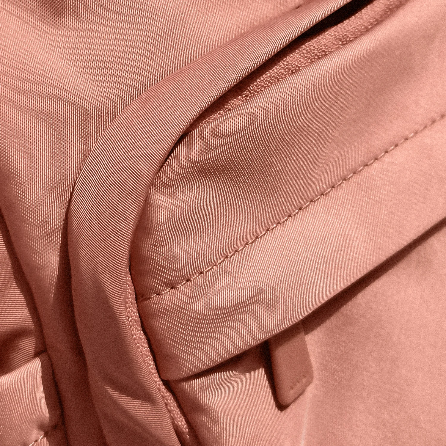 Close up view of Away's featherlight fabric that is super soft, water-resistant, and easy to wipe clean