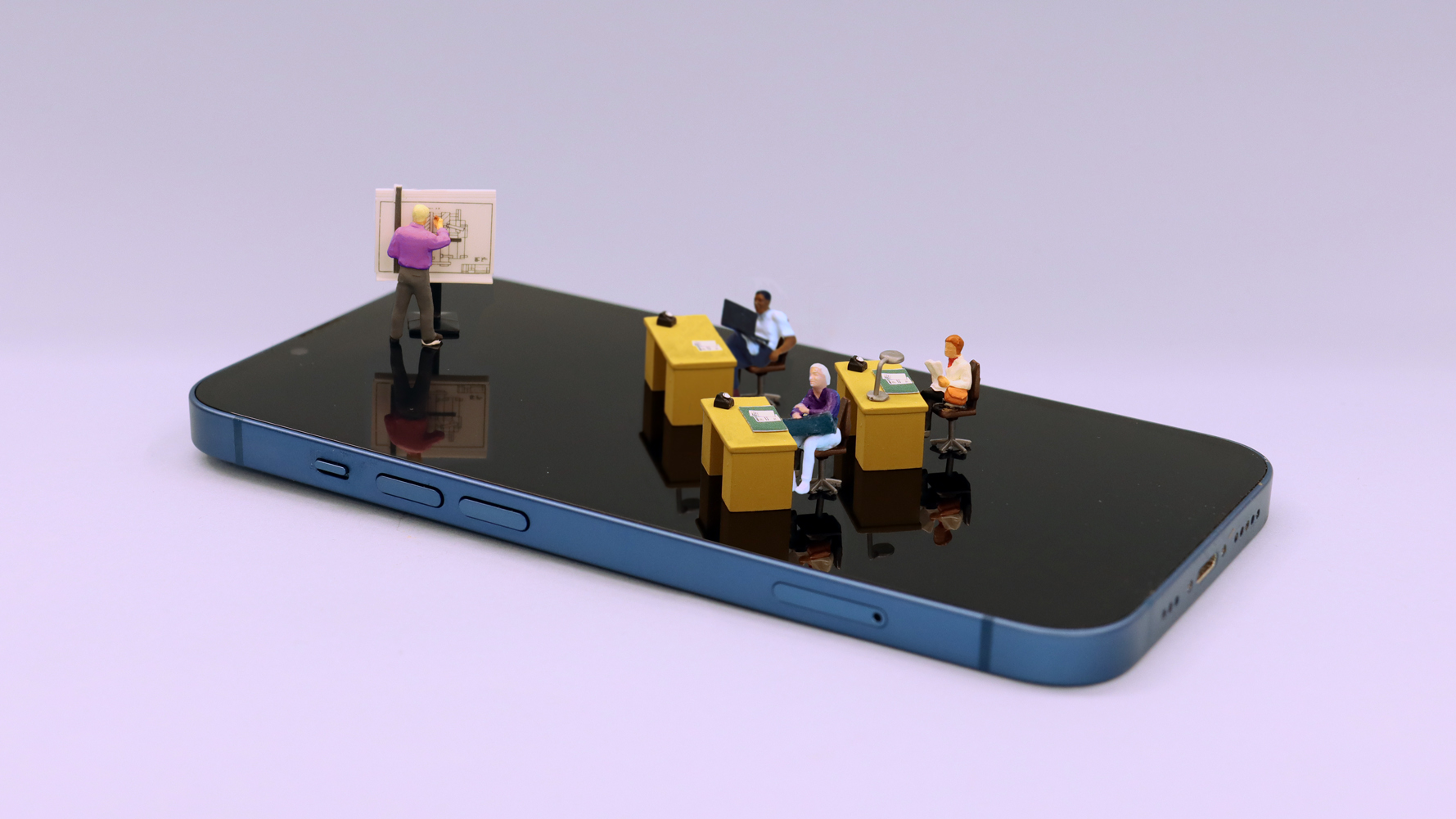 employees study workplace qualifications for career progression on a giant mobile phone