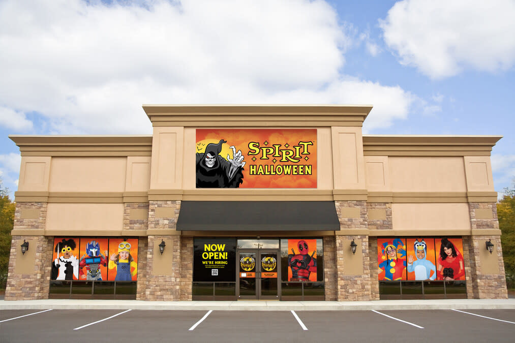 Photo of Spirit Halloween storefront in the daytime with blue skies 