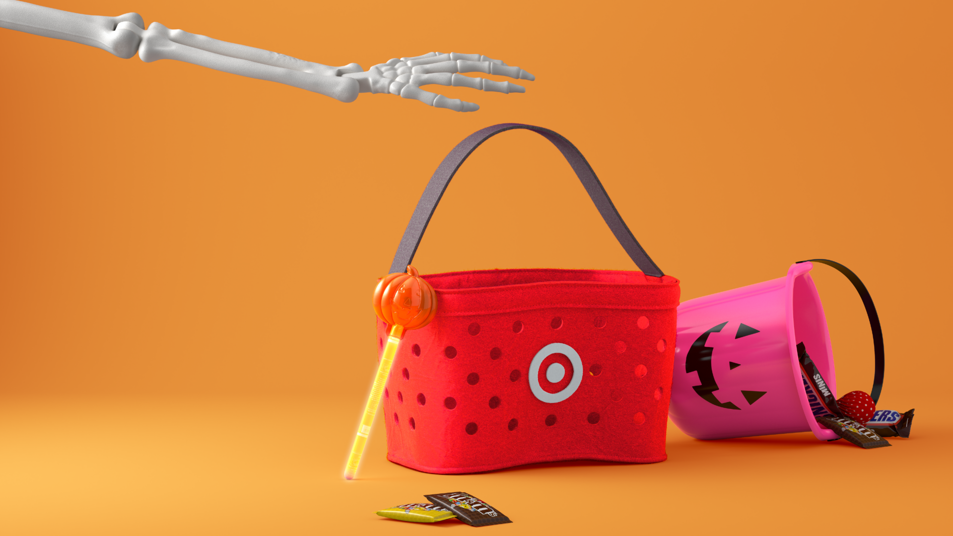 Image from Target for Halloween showing the red Target basket next to a pink pumpkin bucket on an orange background with a skeleton bag reaching for the basket 