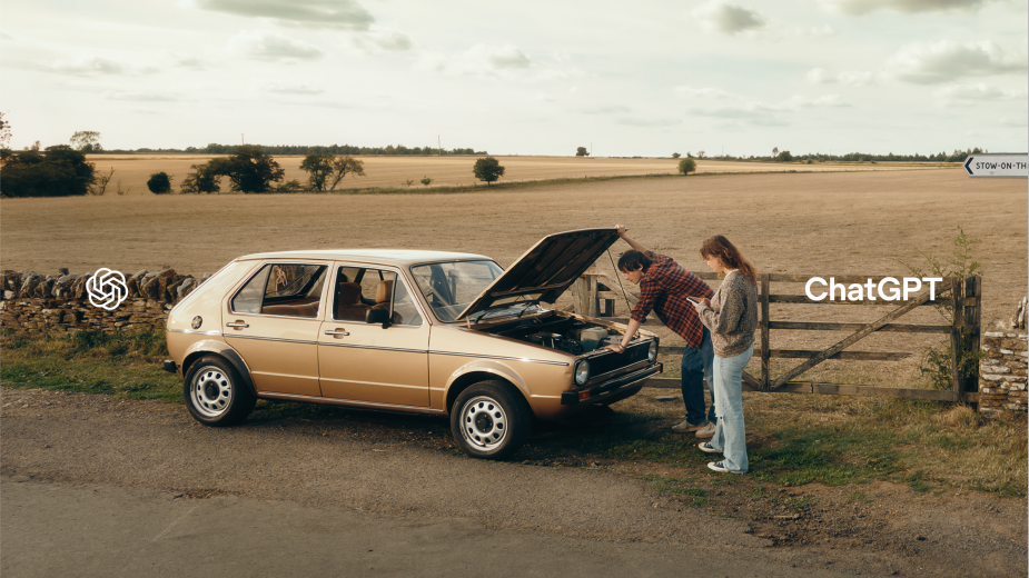 ChatGPT brand campaign photography still of a broken down car with two adults standing by the open car hood and the ChatGPT logo