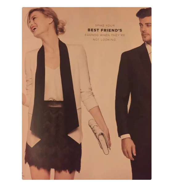  A photo of a white woman wearing a short skirt and dressy jacket and top, holding a small purse looks to the left, laughing and a man wearing a dark suit stands to her right looking at her, with a serious expression. Between them the words “Spike your best friend’s eggnog when they’re not looking” are printed. 