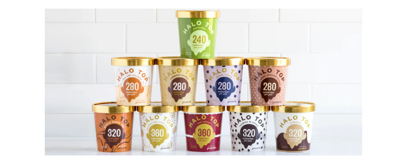 pints of various flavors of Halo Top ice cream are stacked in a pyramid