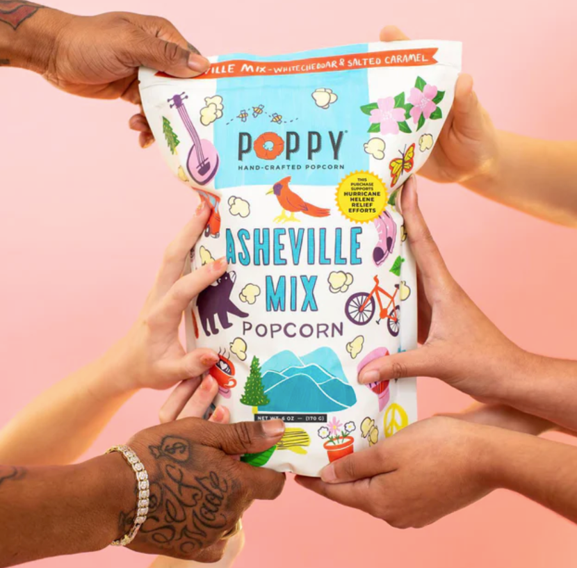 diverse consumers each hold a bag of Asheville Mix popcorn