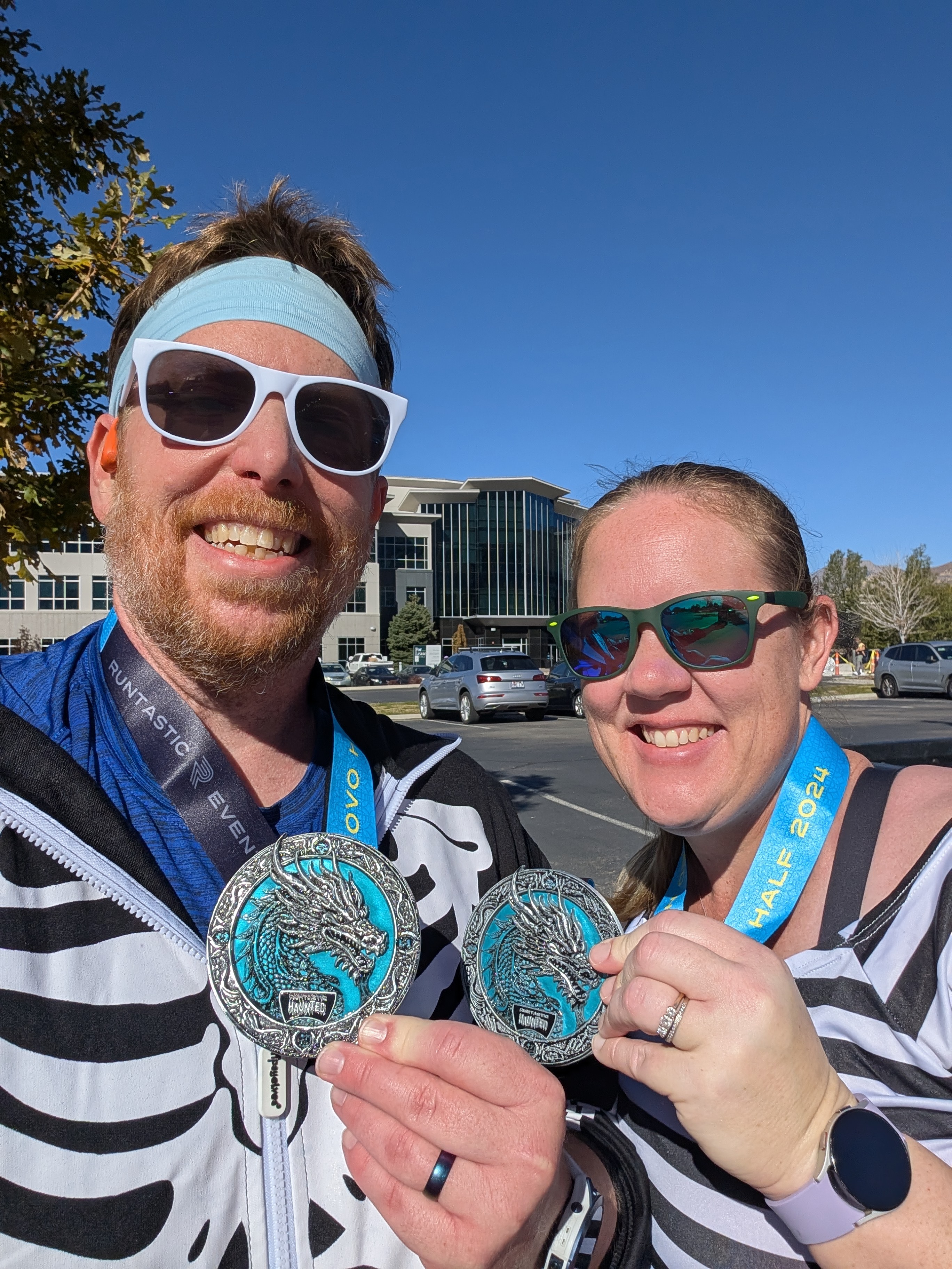 Provo Haunted Half - 13.1 - 2024 - Chad and Sara with Medals