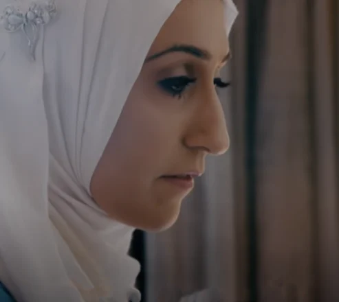 Sam Latif, Procter & Gamble Inclusive Design Consultant photographed from the side. She is wearing a white hijab.