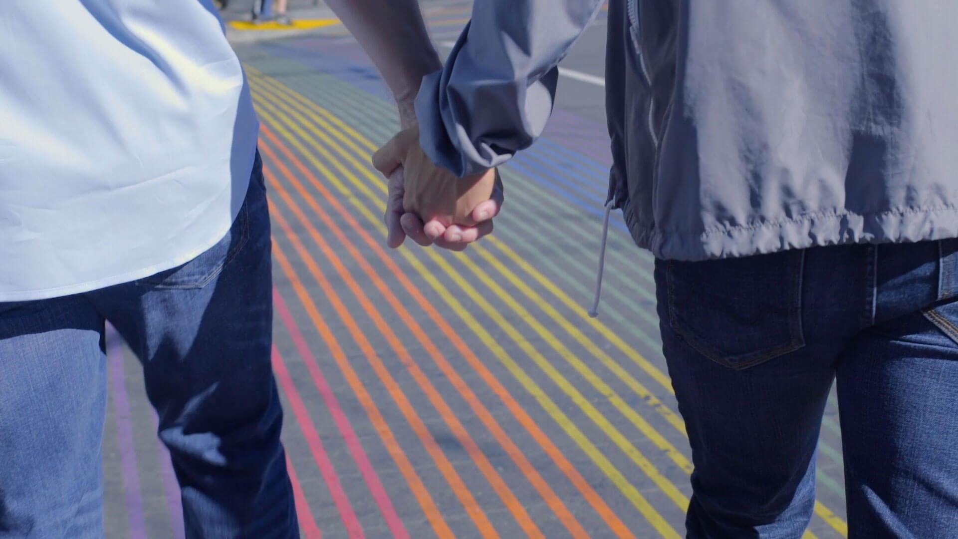 2 men holding hands