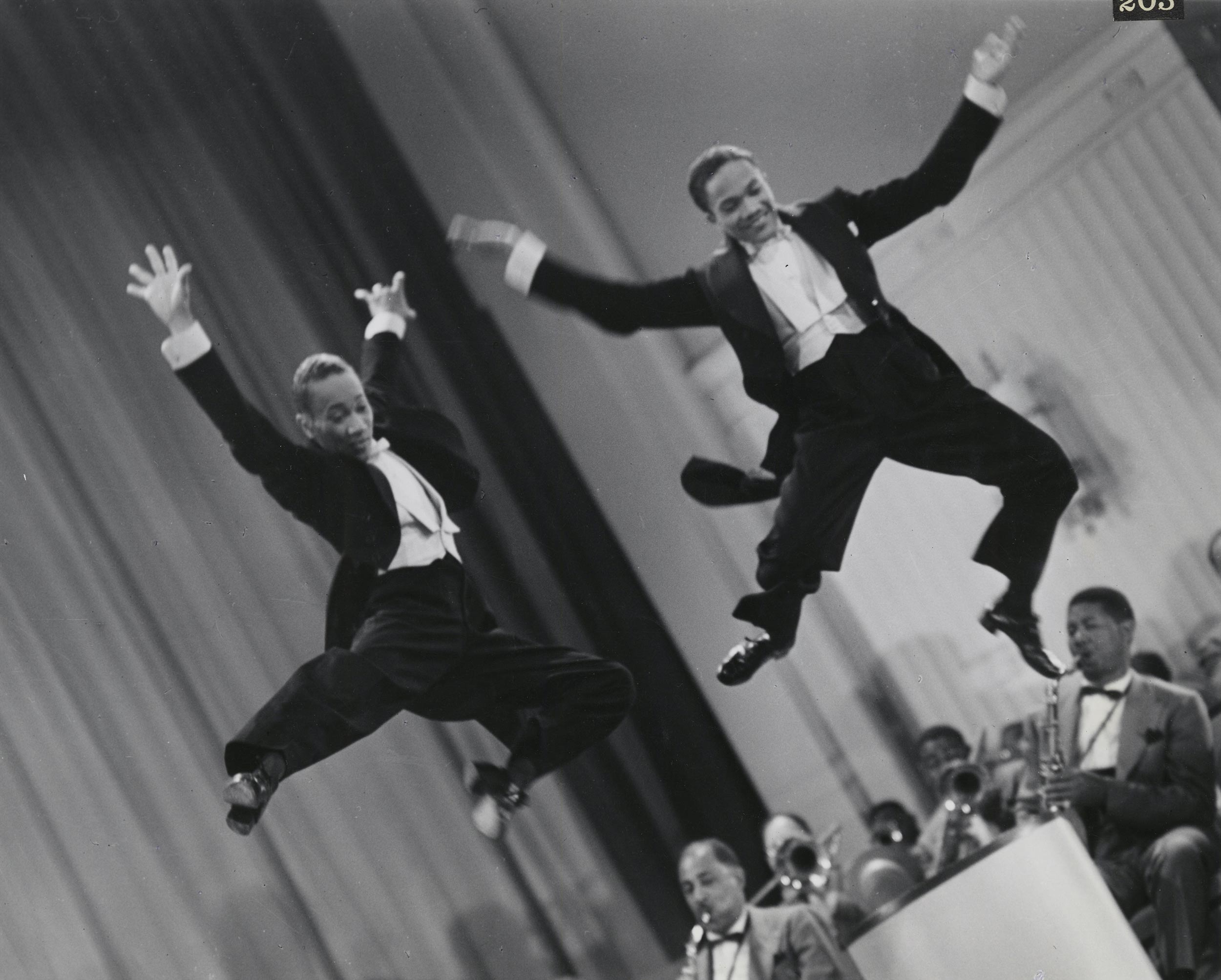 The Nicholas Brothers in a scene from Stormy Weather, 1943, from left, Fayard Nicholas and Harold Nicholas. Photographic print, gelatin silver. Courtesy Margaret Herrick Library, ©Twentieth Century Fox