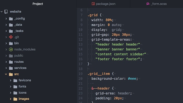 A text editor with a file open showing CSS grid properties