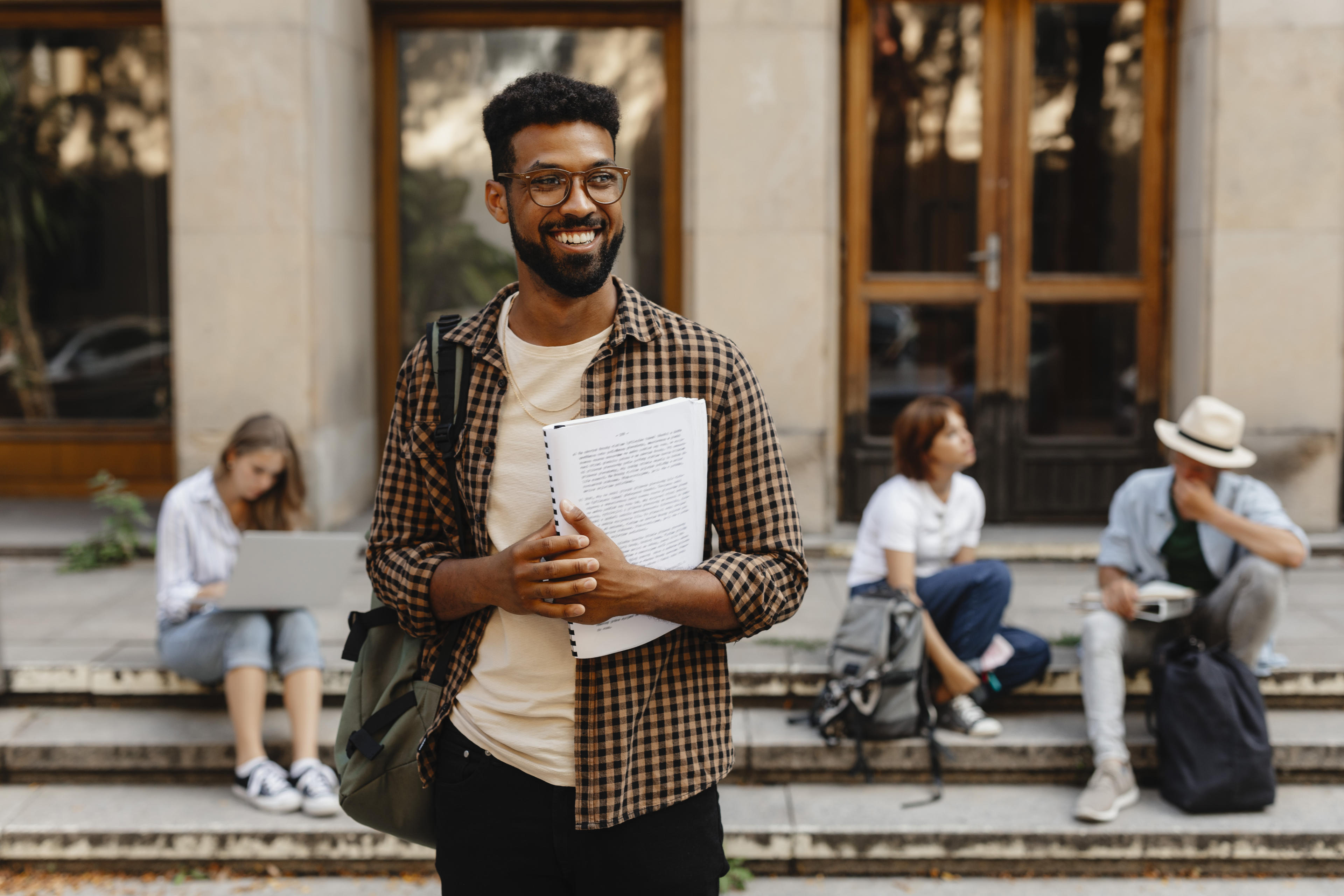 Smiling man with notebook