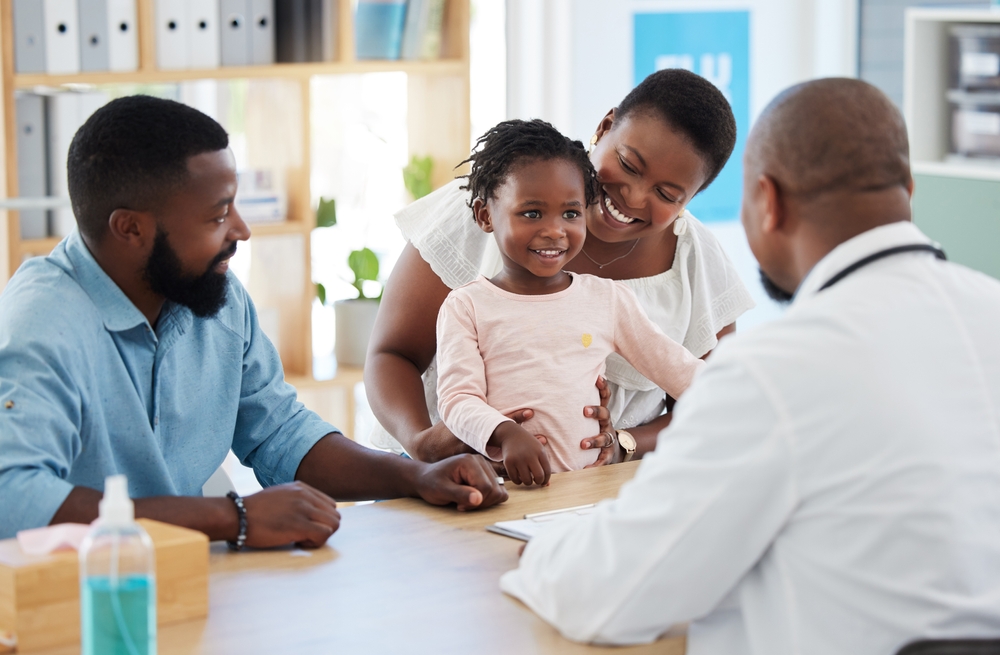 Physician with a young child and her family