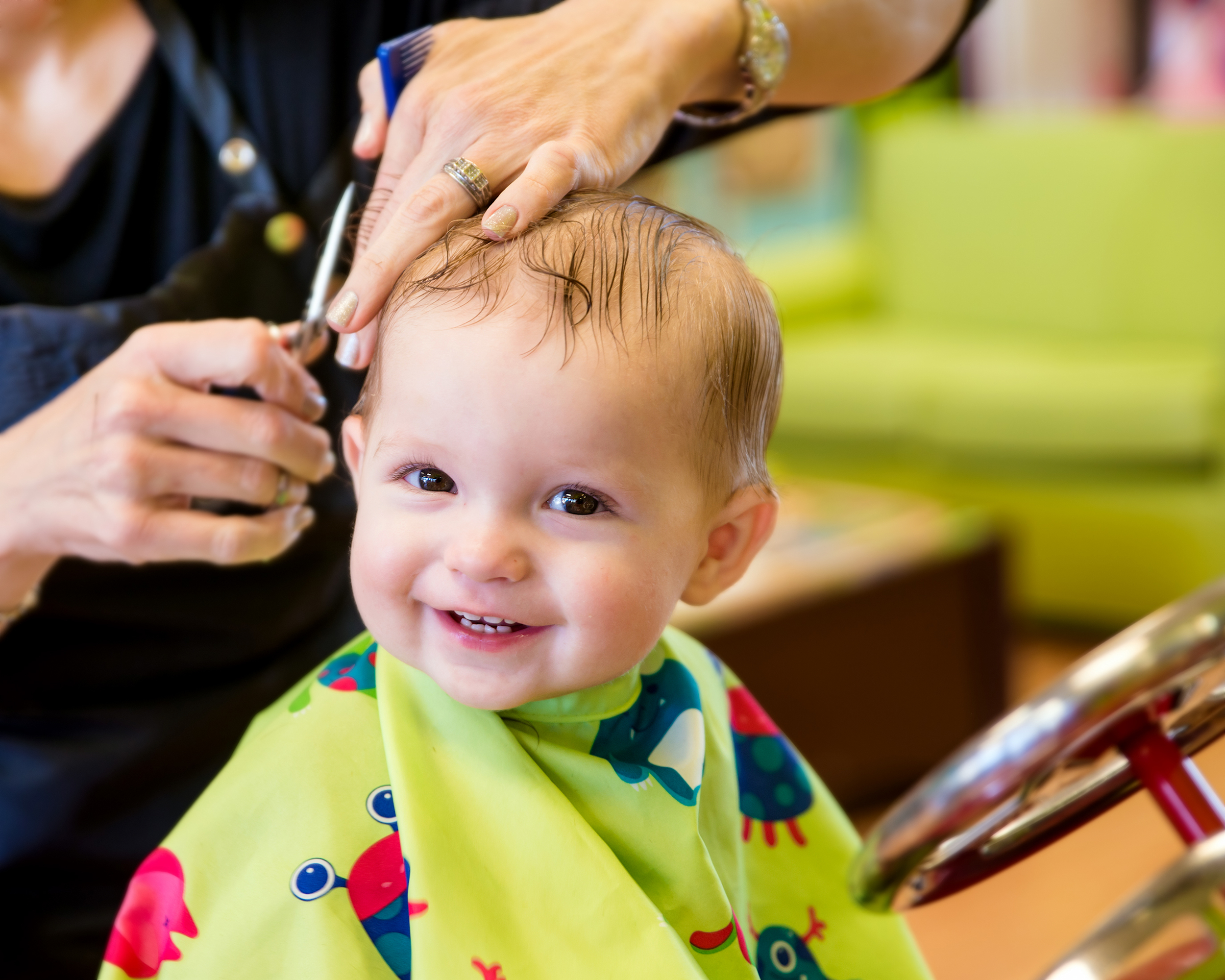 Child receiving a haircut with calm and gentle handling