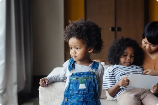 child in overalls