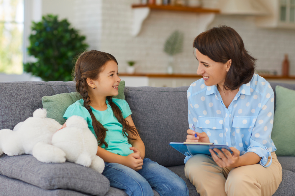 A therapist and a girl in a therapy session