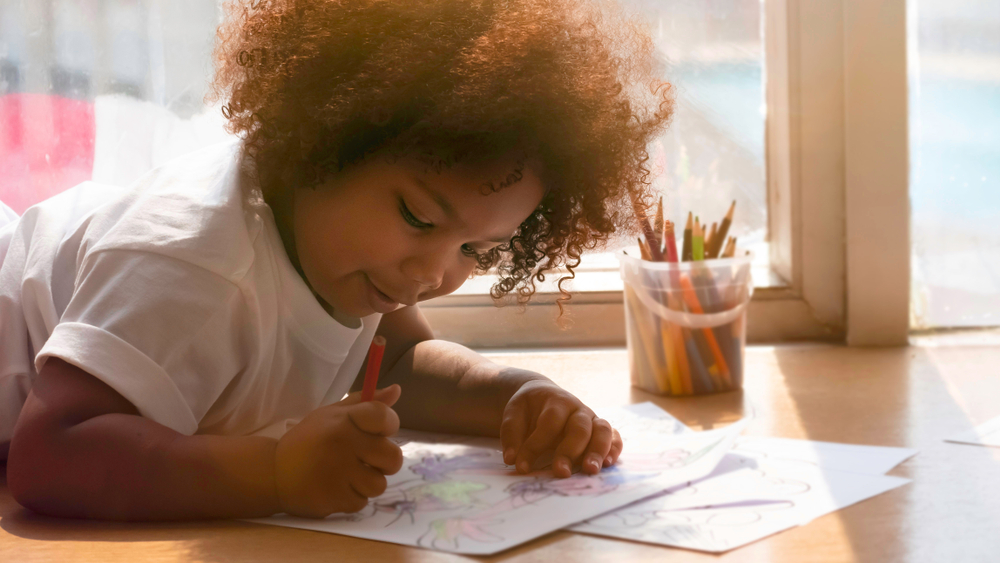 A child drawing at home