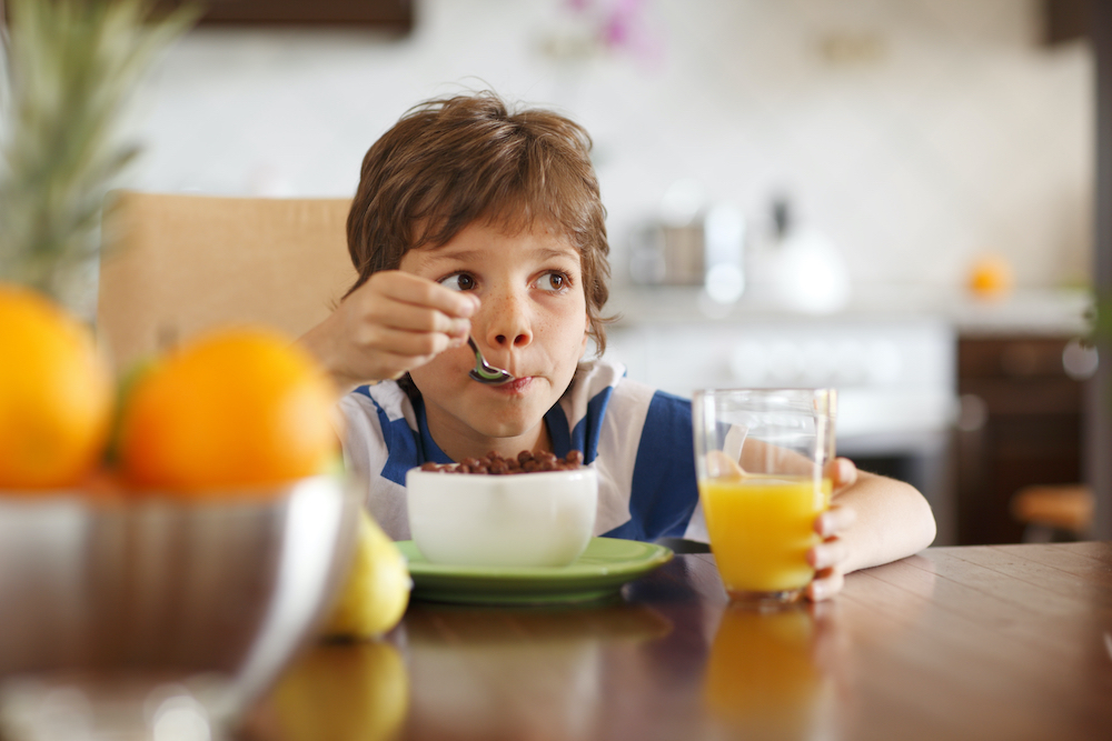a child eating breakfast cereal