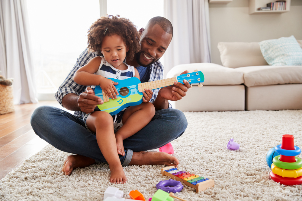 caregiver and child playing with toys together