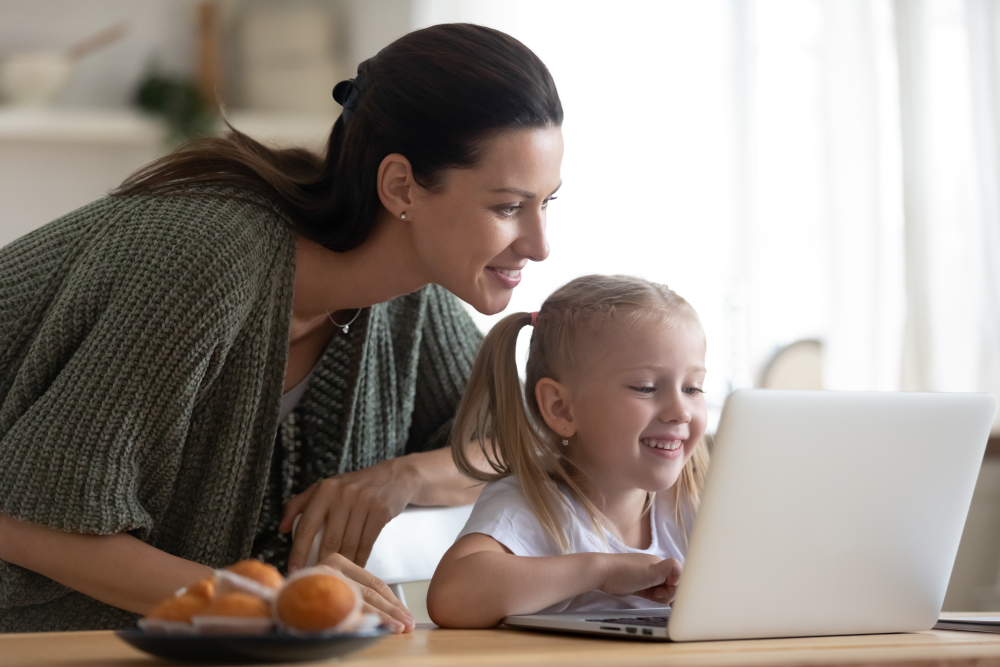 Child and Mother on Laptop