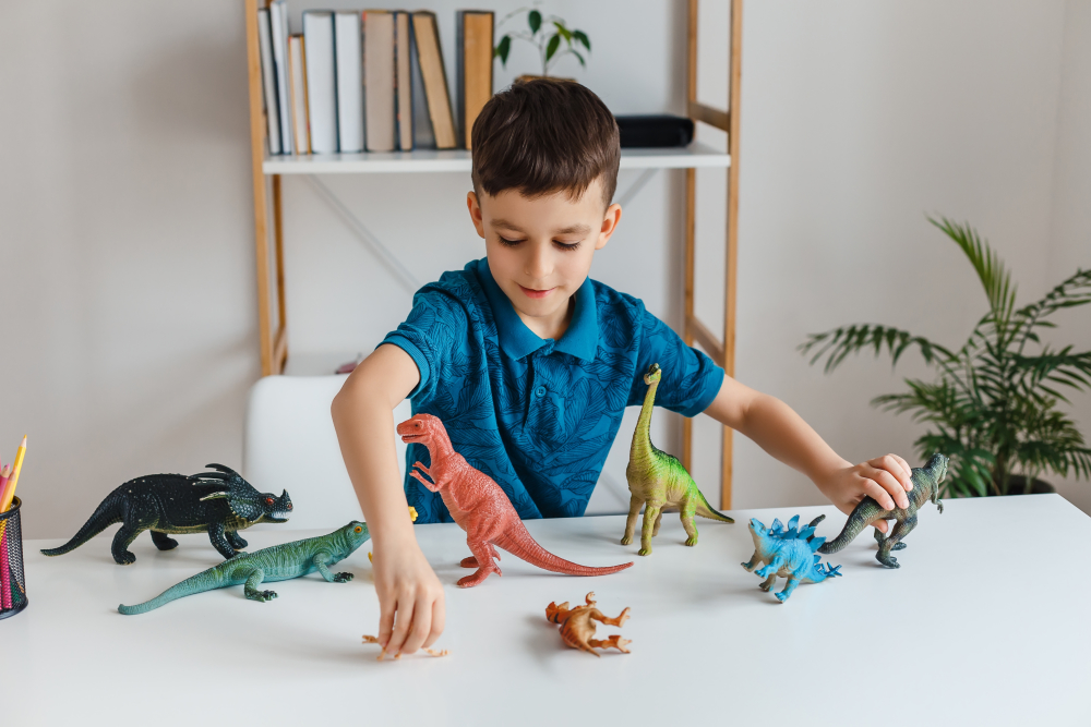 A boy organizing his toys