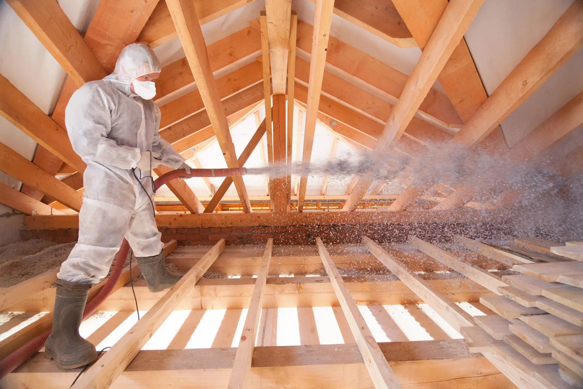 spraying foam insulation in attic