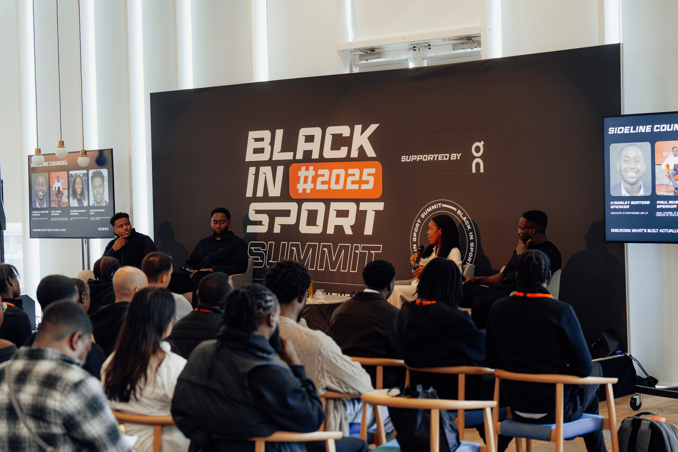 three sports jounalists sitting on sofa