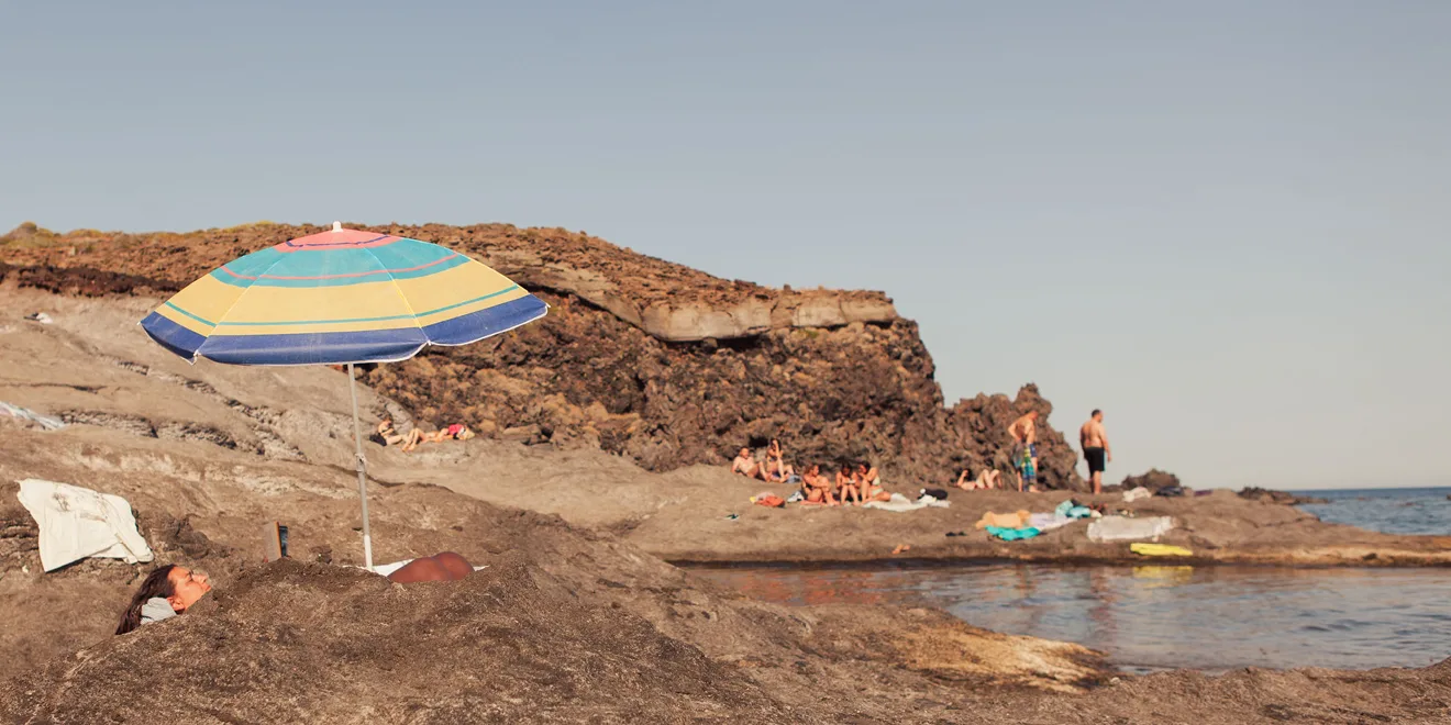 Photo of the rocky beaches of Pantelleria Island Italy.