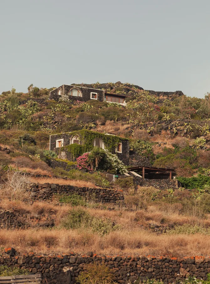 Ancient homes on the volcanic shores of Pantelleria, Italy.