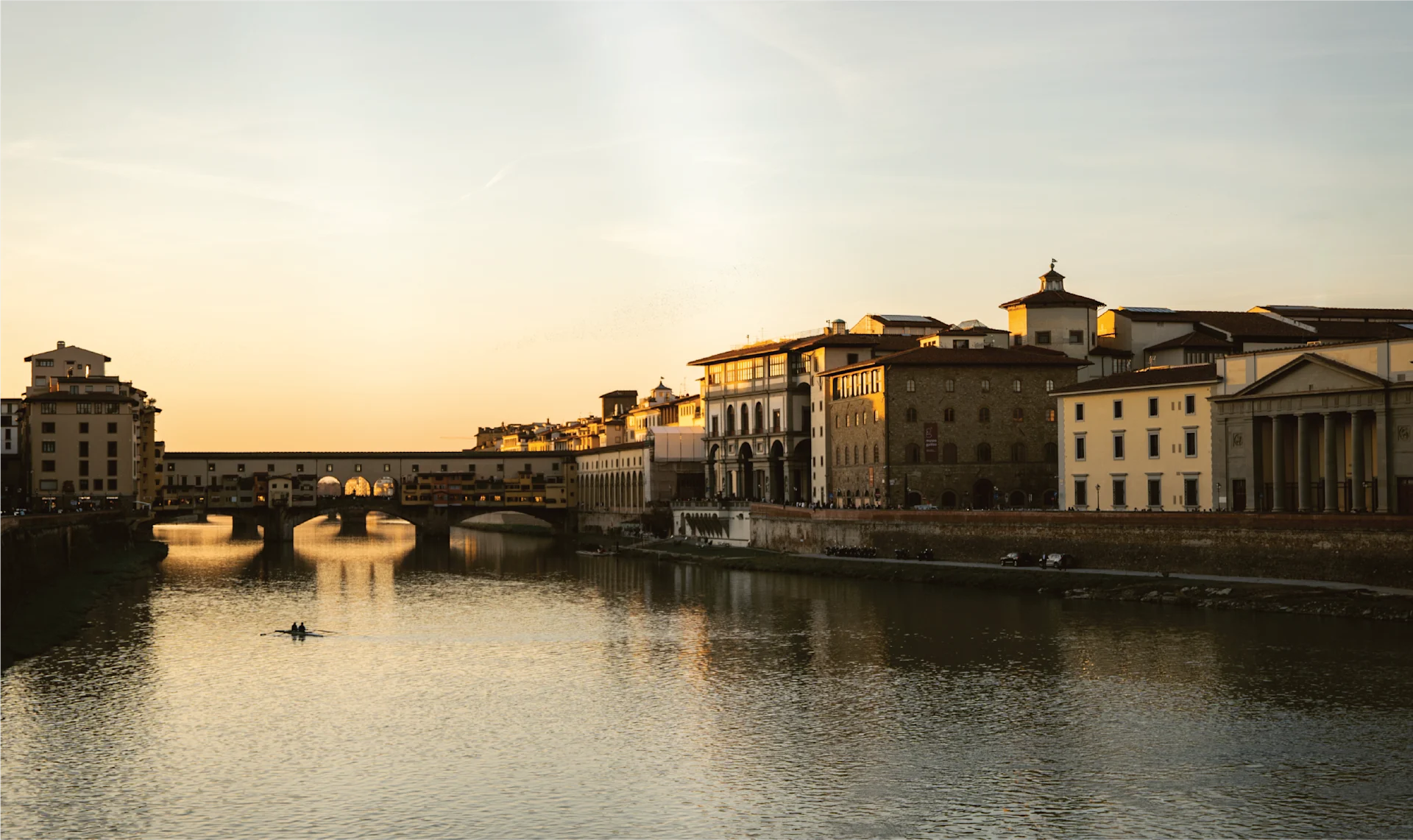 Close-up of a cosy kitchen scene with simmering pots, wooden utensils, and seasonal vegetables prepared for traditional Tuscan cooking.