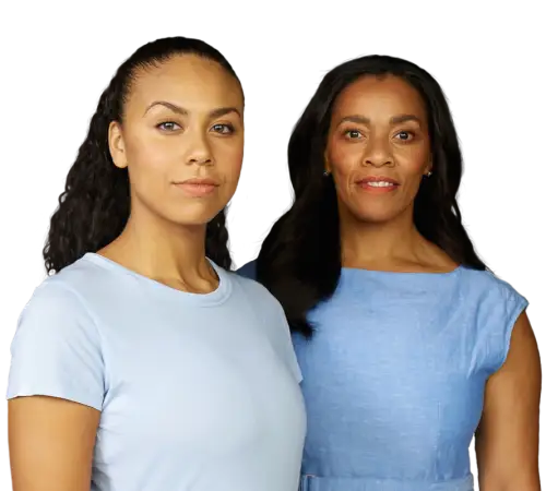 Two ethnic woman standing together with blue blouses - Invitae genetic testing