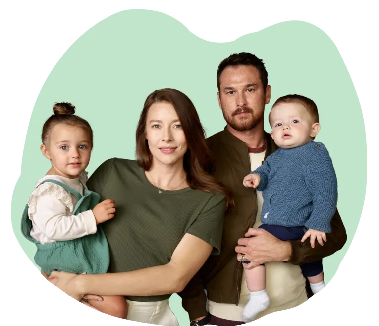 Family of four on green background – Invitae Genetic Testing for Employee Benefits