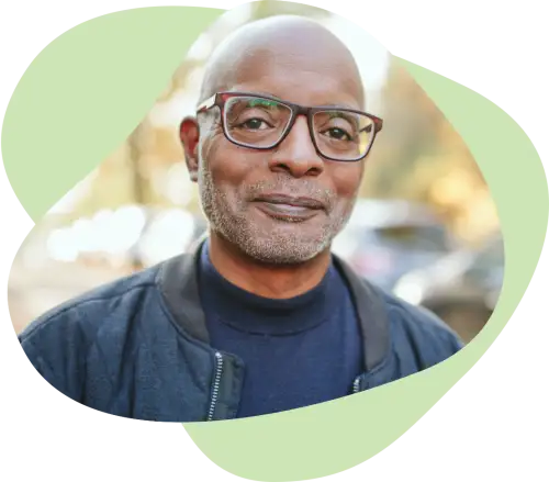 Middle aged black male with glasses outdoors